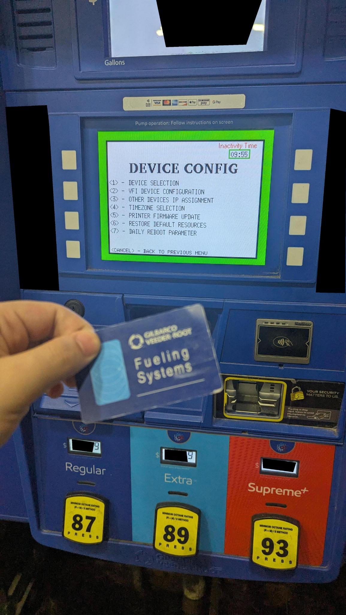 Gilbarco Veeder-Root Fueling Systems diagnostic card, held against the pump's DEVICE CONFIG screen